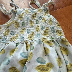Smock romper with egg/chick design